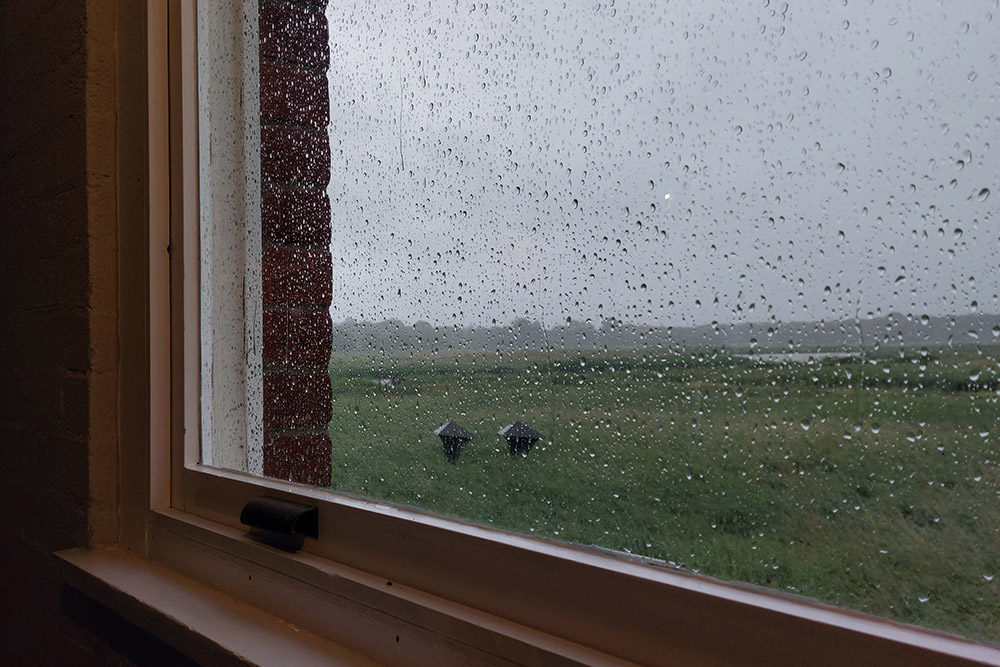 The view through the window of the cafe at the rain