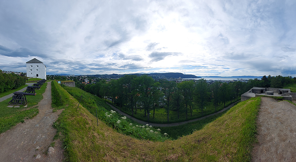 Image: A panoramic view from Kristiansten Fortress looking down on the city of Trondheim and out to its fjord.